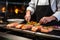 chef preparing grilled salmon steaks in a restaurant kitchen