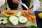 Chef preparing a healthy fresh lunch with fruit: papaya pawpaw