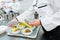 Chef preparing plates in canteen kitchen