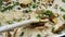 chef preparing porcini mushroom and asparagus Risotto in a professional kitchen