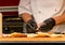 Chef preparing subway sandwich, live cooking session. Fast food festival, street food