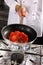 Chef preparing tomato