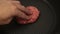 A chef puts beef patties on the grill. A juicy beef cutlet, fried in a pan. Close-up of a beef cutlet for a burger on the grill.