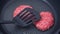 A chef puts beef patties on the grill. A juicy beef cutlet, fried in a pan. Close-up of beef cutlet for a burger on the grill