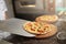 Chef puts on board freshly prepared pizza