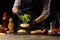 The chef puts fresh salad on a burger loaf, with the background ingredients. Delicious and harmful food, fast food, homemade