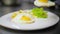 Chef puts omelet on a plate