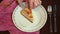 Chef putting cake slice on plate. Piece of apple pie on dish. Sliced apple pie