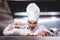 Chef putting finishing touch on salad