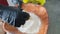 Chef putting the fish in flour ready to fry. Cooking fish. Hands close up.