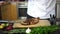 Chef putting sauce, spices and herbs on roasted meat