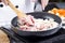 Chef putting slice pf pork to the pan for cooking Japanese pork