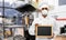 Chef in respirator with chalkboard at kitchen