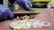 Chef at restaurant cutting figs on wood board preparing natural meal