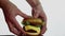 Chef\'s hand adjusts ingredients of a big burger on a dish. Big juicy burger with beef cutlet, fresh vegetables and cream