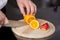 Chef\'s Hand Cutting Orange For Garnishing