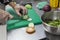 ChefÂ´s hand cutting slice cucumbers