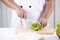 Chef\'s hands cutting lettuce