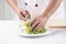 Chef\'s hands cutting lettuce