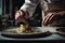 A Chef\'s Hands Skillfully Preparing a Delicious Gourmet Dish extreme closeup. Generative AI