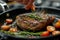Chef seasoning grilled steak with herbs on kitchen pan