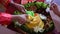 Chef serving nasi tumpeng (cone rice) served with urap-urap (Indonesian salad)