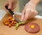 Chef is serving tartare with french fries and avocado