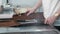 Chef sharpens a knife in the kitchen of the restaurant