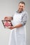 Chef showing food on plate and smiling