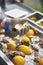 Chef shucking a fresh oyster with knife and stainless steel mesh oyster glove.