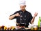 Chef sifts flour through a sieve on a white isolated background