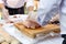 Chef sliced pork cutting on wood board