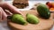 Chef slicing avocado with knife