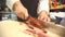 Chef slicing bacon in kitchen