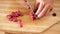 Chef slicing beef cutlet using sharp knife, close-up