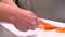 Chef slicing smoked salmon fish fillet