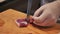 A chef slicing tuna fillet for sashimi producing.