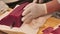 A chef slicing tuna fillet for sashimi producing.