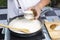 Chef spoon mushroom cream soup into a cup