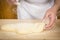 Chef sprinkling flour on the gnocchi dough