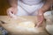 Chef sprinkling flour on the gnocchi dough