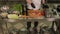 Chef sprinkling fresh pork steak with pepper on a wooden Board in a restaurant