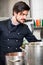 Chef stirring a huge pot of stew or casserole