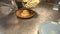 Chef taking out boiling italian pasta with tongs in restaurant