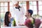 Chef talking to couple at restaurant