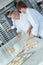 Chef teaching apprentice to make pastry crust