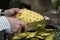 Chef trimming a pineapple to prepare some cockatiels 