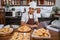 A chef uses a laptop to sell homemade donuts