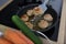 Chef uses spatula to flip over fried cutlets in kitchen closeup