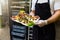 Chef or waiter holding platter full of fresh canapes finger food snacks for buffet meal at restaurant